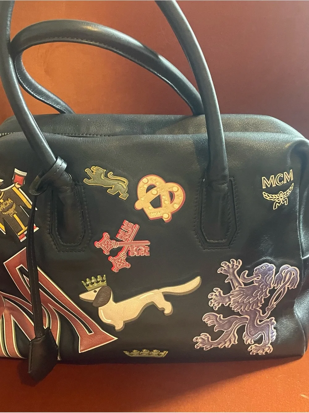 MCM Black Leather Satchel with Multicolor Patch Motifs